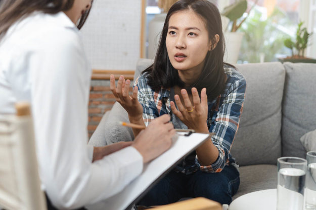 Woman in a therapy session at a heroin abuse rehab